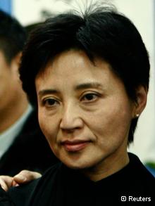 Gu Kailai, wife of China s former Chongqing Municipality Communist Party Secretary Bo Xilai, poses for a group photo at a mourning held for her father-in-law Bo Yibo, former vice-chairman of the Central Advisory Commission of the Communist Party of China, in Beijing in this January 17, 2007 file photo. Neil Heywood, the British businessman whose murder has sparked political upheaval in China was poisoned after he threatened to expose a plan by a Chinese leader s wife to move money abroad, two sources with knowledge of the police investigation said. Heywood had spent his last week in Chongqing in Nan an district, an area politically loyal to Bo, and stayed at two hotels: the Nanshan Lijing Holiday Hotel and the Sheraton hotel. Picture taken January 17, 2007. REUTERS/Stringer/Files (CHINA - Tags: POLITICS CRIME LAW HEADSHOT BUSINESS) CHINA OUT. NO COMMERCIAL OR EDITORIAL SALES IN CHINA