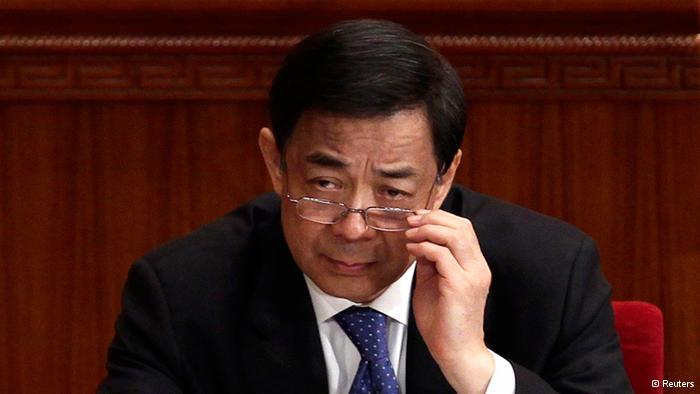 China's Chongqing Municipality Communist Party Secretary Bo Xilai adjusts his glasses during the opening ceremony of the Chinese People's Political Consultative Conference (CPPCC) at the Great Hall of the People in Beijing in this March 3, 2012 file picture. China's Communist Party suspended former high-flying politician Bo from its top ranks and named his wife, Gu Kailai, a suspect in the murder of British businessman Neil Heywood, in revelations on April 10, 2012 likely to shake leadership succession plans. REUTERS/Jason Lee/Files (CHINA - Tags: POLITICS)

