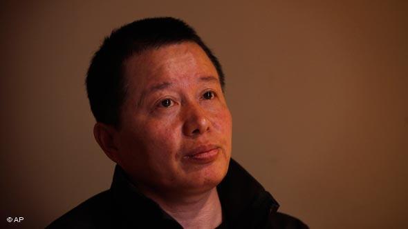 Gao Zhisheng, a human rights lawyer, pays attention to a question during his first meeting with the media since he resurfaced two weeks ago, at a tea house in Beijing, China, Wednesday, April 7,  2010.  Gao, whose disappearance more than a year ago caused an international outcry, said Wednesday that he is abandoning his once prominent role as a government critic in hopes of reuniting with his family. In the meeting, Gao said he did not want to discuss his disappearance. (AP Photo/Gemunu Amarasinghe)