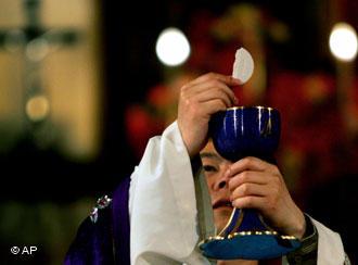 A Chinese priest performs mass at Beijing's northern cathedral in China Monday May 8, 2006. China's official Roman Catholic church named a new bishop _ reportedly with papal endorsement _ as Beijing rejected Vatican criticism of the unauthorized ordination of two other bishops. China's Catholics were forced to cut ties to the Vatican after the 1949 communist revolution. But the Holy See and China's church communicate informally and most Chinese bishops have received papal endorsement. (AP Photo/Elizabeth Dalziel)