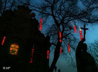 Traditional Chinese lanterns light decorate the entrance to the Southern cathedral in Beijing, China Tuesday Jan. 23, 2007. China's state-backed Catholic church welcomed a newly announced Vatican initiative to repair ruptured relations with Beijing and said a promised letter from the pope to Chinese Catholics could be helpful. The diplomatic initiative comes as China is experiencing a religious boom while the Vatican remains hobbled by a half-century-long dispute with Beijing. A communist government-backed Catholic church refuses to recognize the Vatican's authority while many clergy and ordinary Catholics remain loyal to the pope and have been persecuted for it. (AP Photo/Elizabeth Dalziel)