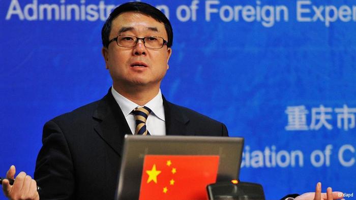 In this Oct. 16, 2011 photo, Chongqing city police chief Wang Lijun delivers a speech during the 2nd International Forensic Science Meeting in southwestern China's Chongqing city. Wang, the celebrity top cop relieved of his duties in a major Chinese city, held a meeting at a U.S. consulate amid unconfirmed reports of an asylum bid but then left the building and his whereabouts were unclear Thursday, Feb. 9, 2012. (AP Photo) CHINA OUT