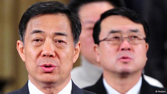 China's former Chongqing Municipality Communist Party Secretary Bo Xilai (L) and former Deputy Mayor of Chongqing Wang Lijun (R) sing the national anthem during a session of the Chinese People's Political Consultative Conference (CPPCC) of the Chongqing Municipal Committee, in Chongqing municipality in this January 7, 2012 file photo. Wang, the former police chief at the heart of China's biggest political scandal in decades faces trial next week on charges of defection, taking bribes and illegal surveillance. REUTERS/Stringer/Files (CHINA - Tags: CRIME LAW POLITICS) CHINA OUT. NO COMMERCIAL OR EDITORIAL SALES IN CHINA